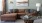 brown sectional surrounded by warm furnishings in a one bedroom Orlando apartment